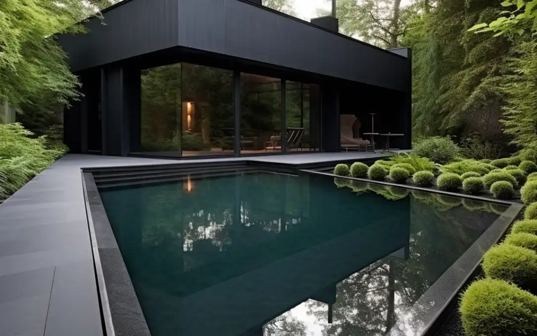 black swimming pool in green nature