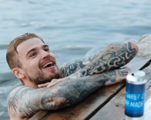swimming tattoo ideas tattoed men in water